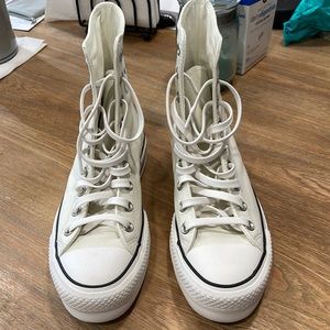 Converse leather high tops.